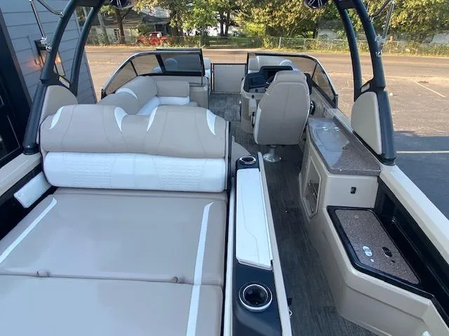Slide: The Image of Interior of 2024 Avalon Catalina 2585 VRB pontoon boat with beige seating and modern amenities. - 21