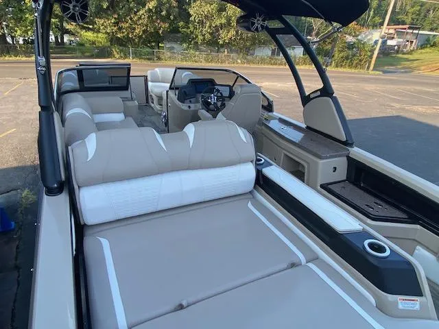 Slide: The Image of 2024 Avalon Catalina 2585 VRB boat interior with luxurious seating and modern dashboard. - 23