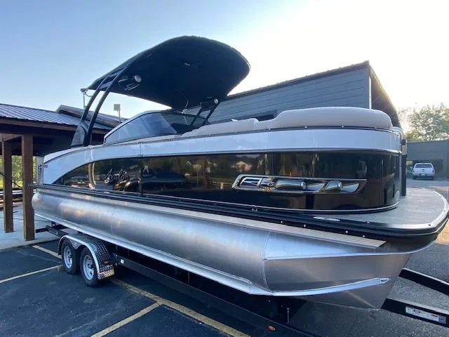 Slide: The Image of 2024 Avalon Catalina 2585 VRB pontoon boat on a trailer. - 3