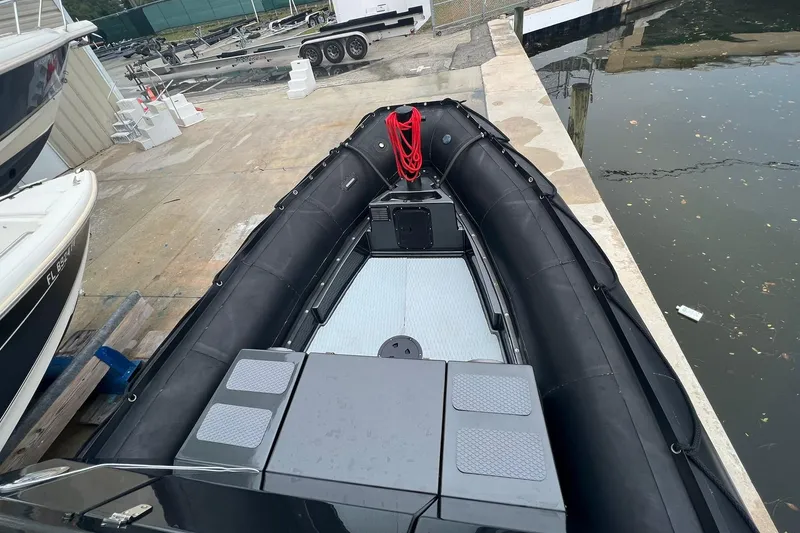 Slide: The Image of 2014 Zodiac Milpro Hurricane Custom boat docked at a marina. - 5