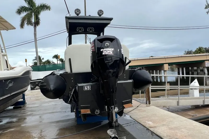 Slide: The Image of 2014 Zodiac Milpro Hurricane Custom boat with Evinrude 225 HP engine at dock. - 14