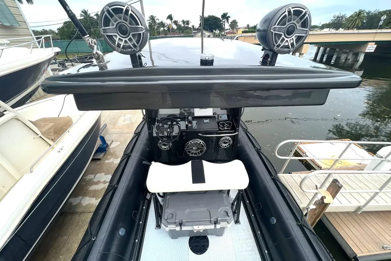 Slide: The Image of 2014 Zodiac Milpro Hurricane Custom boat interior with advanced audio system. - 9