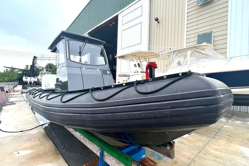 The Image of 2014 Zodiac Milpro Hurricane Custom boat docked at a marina. - 0