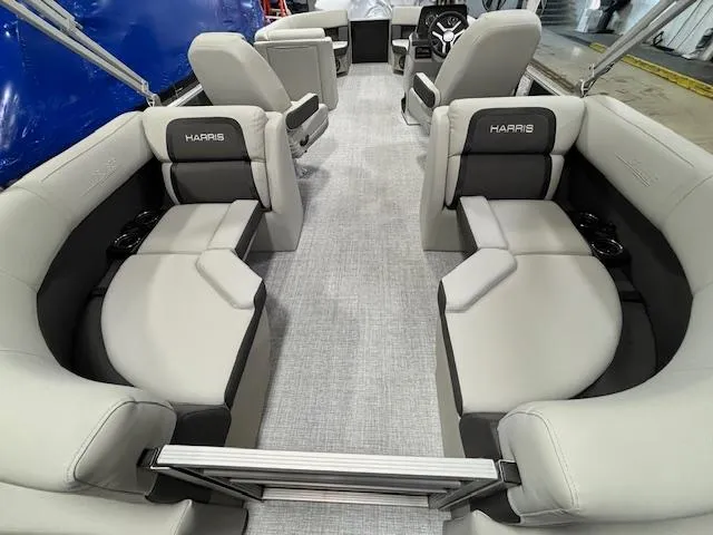 Slide: The Image of 2024 Harris Cruiser 230 CWDH pontoon boat interior with luxurious seating and modern design. - 11