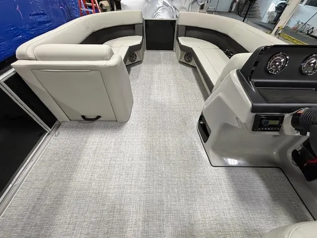 Slide: The Image of 2024 Harris Cruiser 230 CWDH pontoon boat interior with plush seating and modern dashboard. - 18