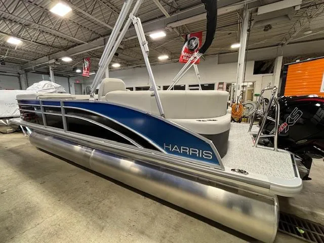 Slide: The Image of 2024 Harris Cruiser 230 CWDH pontoon boat in showroom. - 3