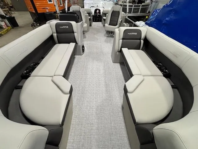 Slide: The Image of 2024 Harris Cruiser 230 CWDH pontoon boat interior with luxurious seating. - 4