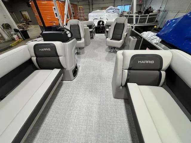 Slide: The Image of 2024 Harris Cruiser 230 CWDH pontoon boat interior with spacious seating and modern design. - 5