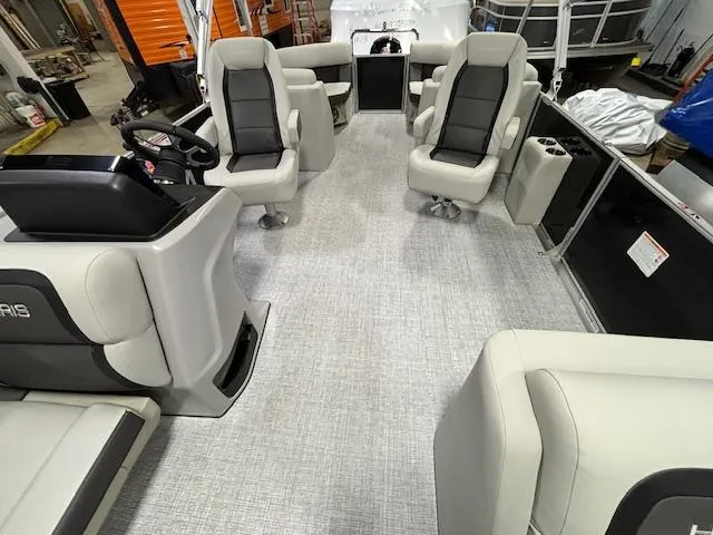 Slide: The Image of 2024 Harris Cruiser 230 CWDH pontoon boat interior with plush seating and modern design. - 6