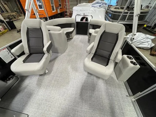 Slide: The Image of 2024 Harris Cruiser 230 CWDH pontoon boat interior with plush seating and modern design. - 7