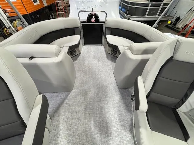 Slide: The Image of Interior of 2024 Harris Cruiser 230 CWDH pontoon boat with plush seating and modern design. - 8