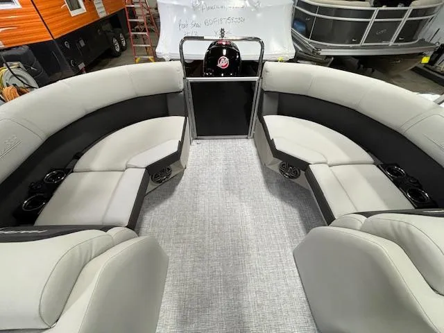 Slide: The Image of 2024 Harris Cruiser 230 CWDH pontoon boat interior with plush seating and modern design. - 9
