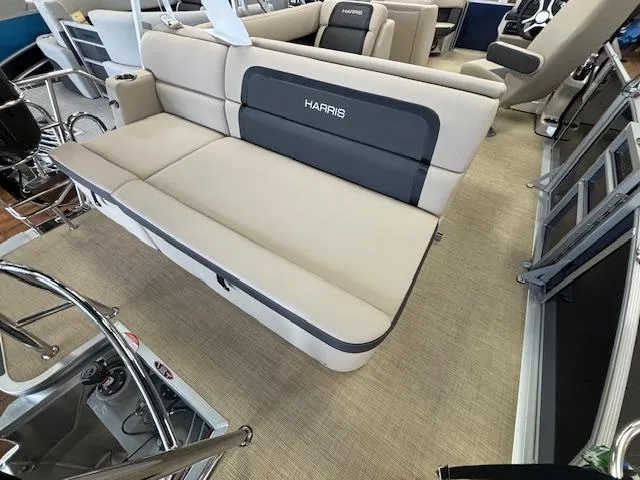 Slide: The Image of 2024 Harris Cruiser 210 CS boat interior with beige and black seating. - 10