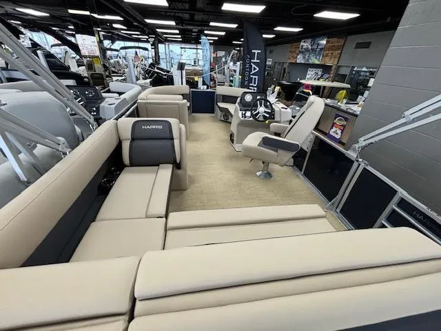 Slide: The Image of 2024 Harris Cruiser 210 CS pontoon boat interior with beige seating and modern helm. - 14