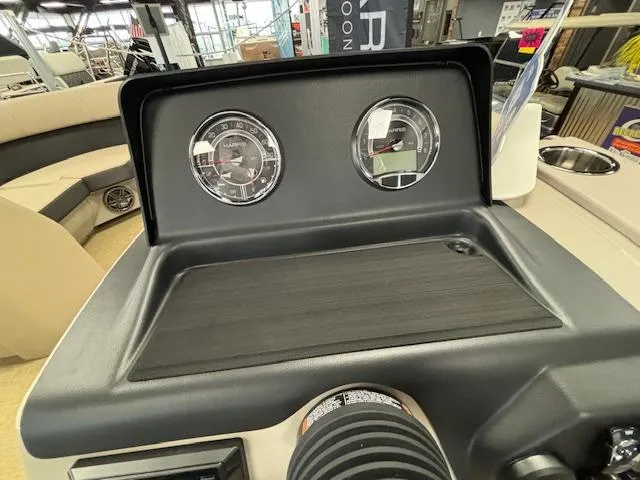 Slide: The Image of 2024 Harris Cruiser 210 CS dashboard with gauges and controls. - 17