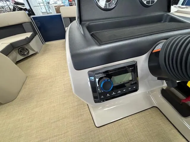 Slide: The Image of 2024 Harris Cruiser 210 CS boat interior with control panel and seating. - 18