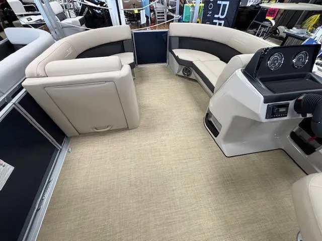Slide: The Image of Interior of 2024 Harris Cruiser 210 CS pontoon boat with beige seating and modern dashboard. - 19