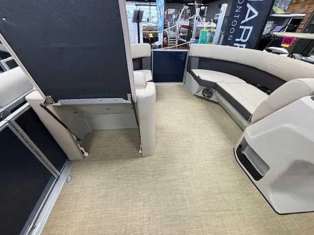 Slide: The Image of 2024 Harris Cruiser 210 CS pontoon boat interior with beige seating and flooring. - 20
