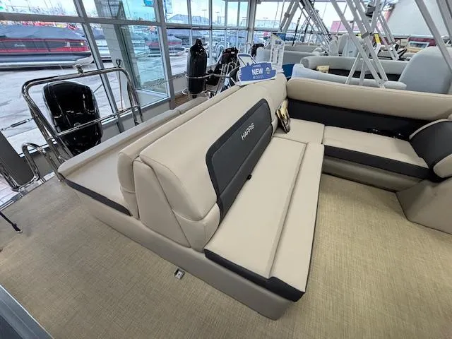 Slide: The Image of 2024 Harris Cruiser 210 CS pontoon boat interior with beige seating. - 8