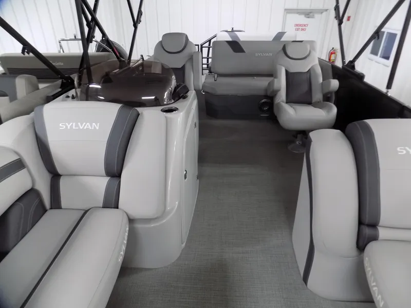 Slide: The Image of 2024 Sylvan L3 DLZ pontoon boat interior with gray seating and modern design. - 2