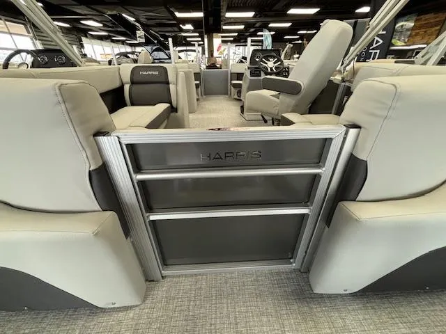 Slide: The Image of 2024 Harris CRUISER 190 CW pontoon boat interior with gray seating and modern design. - 11
