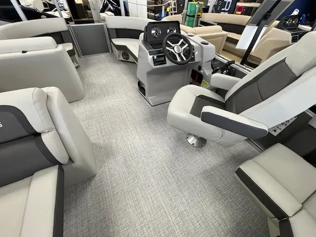 Slide: The Image of 2024 Harris CRUISER 190 CW boat interior with modern seating and steering console. - 13