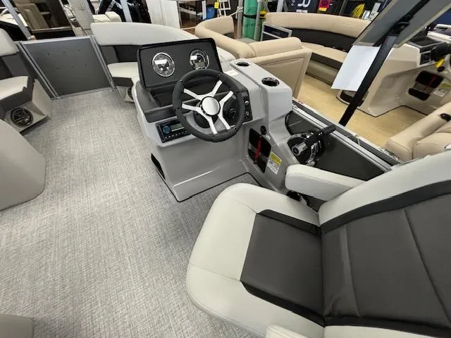 Slide: The Image of 2024 Harris CRUISER 190 CW boat interior with steering wheel and seating. - 14
