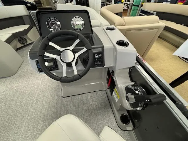 Slide: The Image of 2024 Harris CRUISER 190 CW boat steering console with modern controls and gauges. - 15