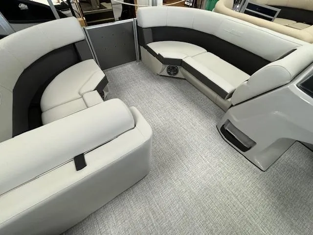 Slide: The Image of 2024 Harris CRUISER 190 CW boat interior with gray and black seating. - 19