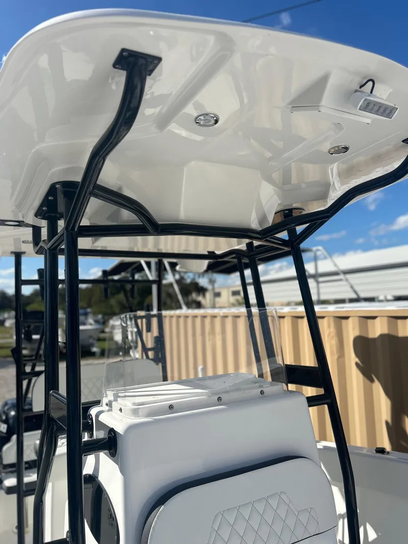 Slide: The Image of Clearwater 2300 boat, 2022 model, featuring a sleek white T-top and black frame. - 15