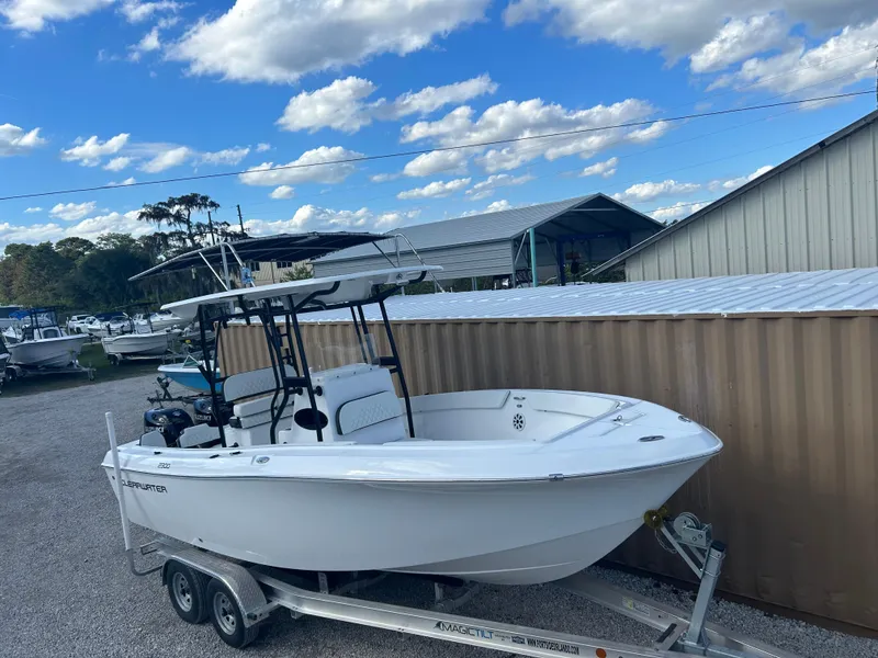 Slide: The Image of 2022 Clearwater 2300 boat on trailer in outdoor storage area. - 22