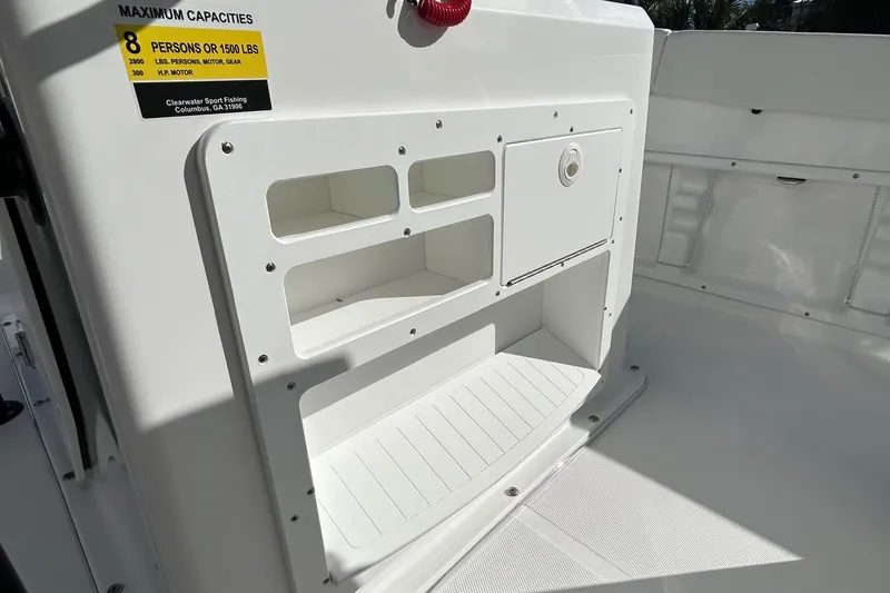 Slide: The Image of Clearwater 2300 boat interior, 2022 model, showing storage compartments and capacity label. - 29