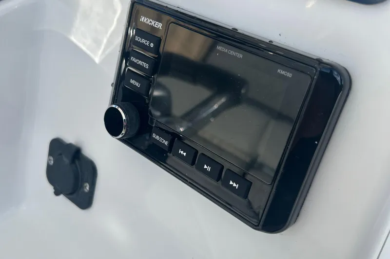 Slide: The Image of 2022 Clearwater 2300 boat media center with Kicker audio system. - 33
