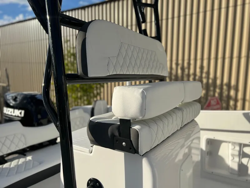 Slide: The Image of 2022 Clearwater 2300 boat with white cushioned seating and Suzuki outboard motor. - 4