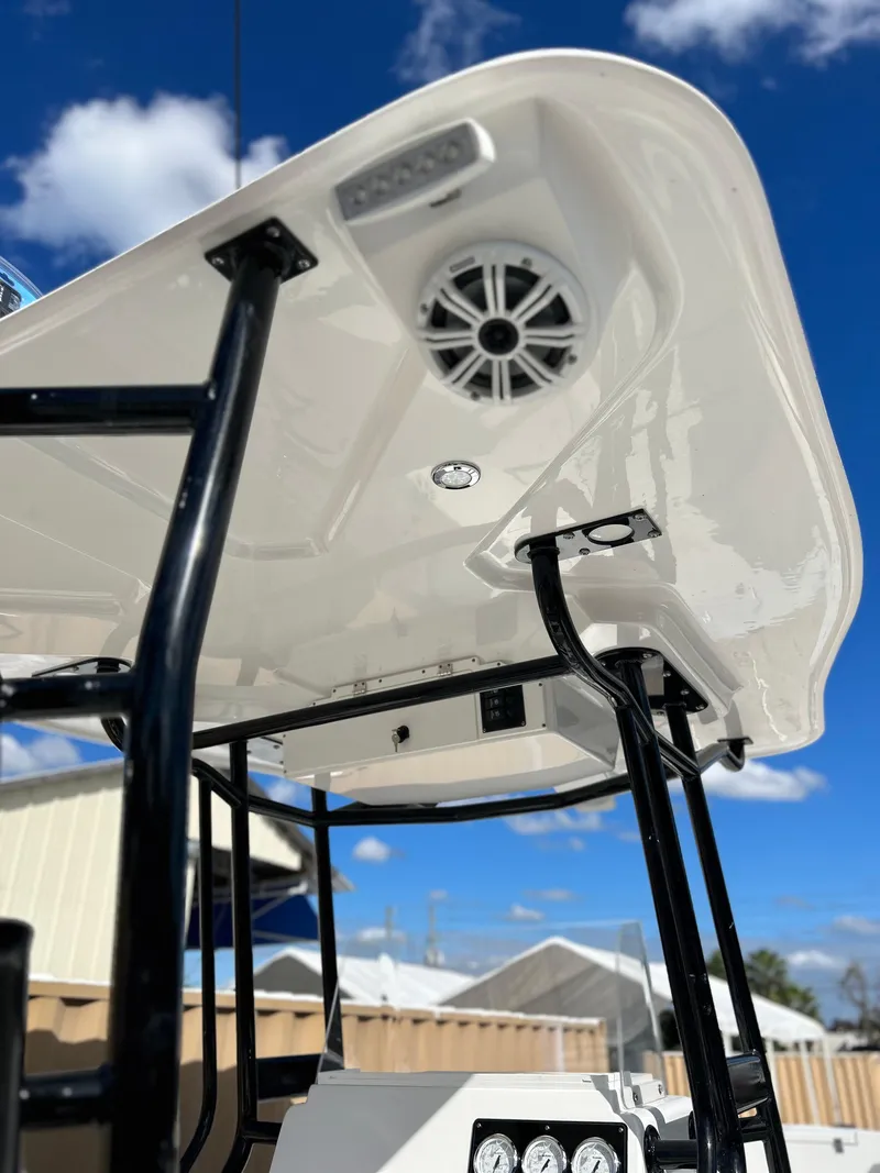 Slide: The Image of 2022 Clearwater 2300 boat with T-top and speaker system. - 8