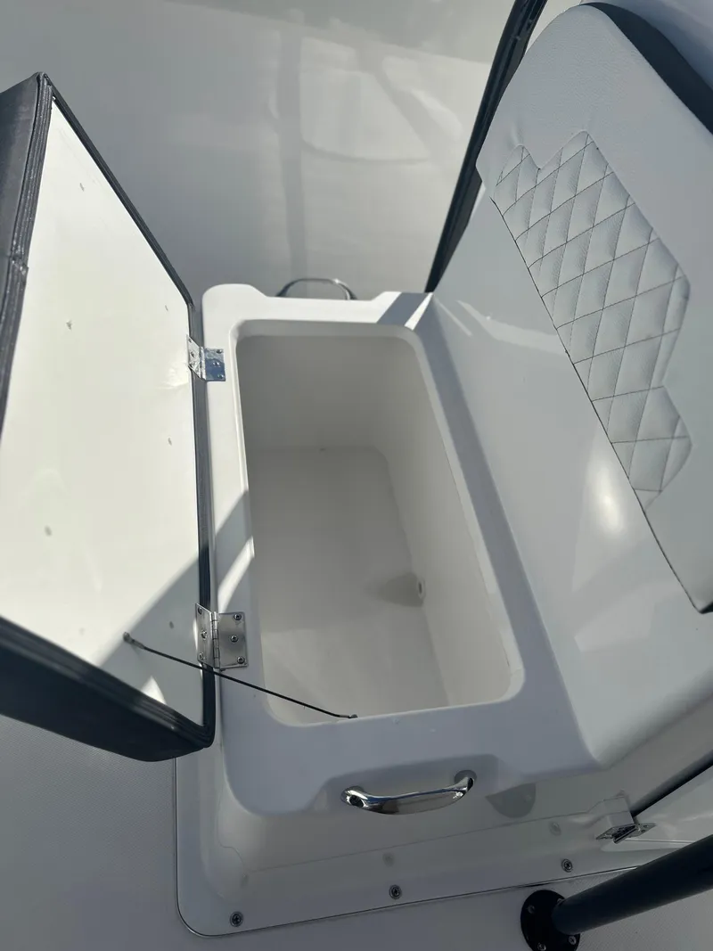 Slide: The Image of Open storage compartment on a 2022 Clearwater 2300 boat. - 9
