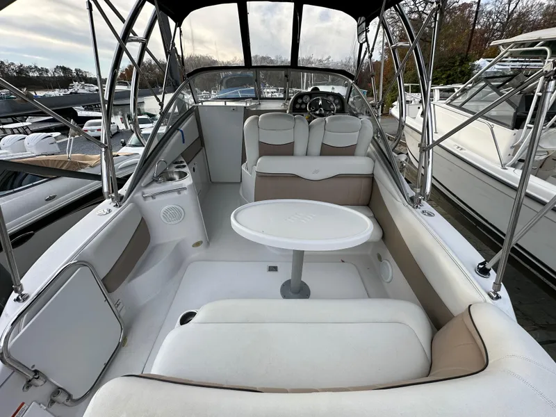 Slide: The Image of 2007 Four Winns 258 Vista boat interior with seating and table. - 1