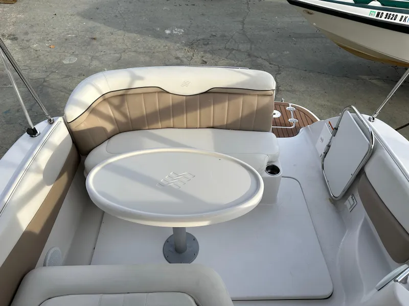 Slide: The Image of 2007 Four Winns 258 Vista boat interior with seating and table. - 31