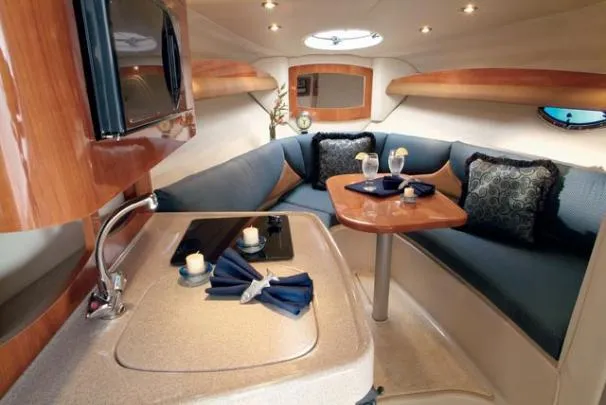 Slide: The Image of 2007 Four Winns 258 Vista boat interior with kitchenette and cozy seating area. - 35