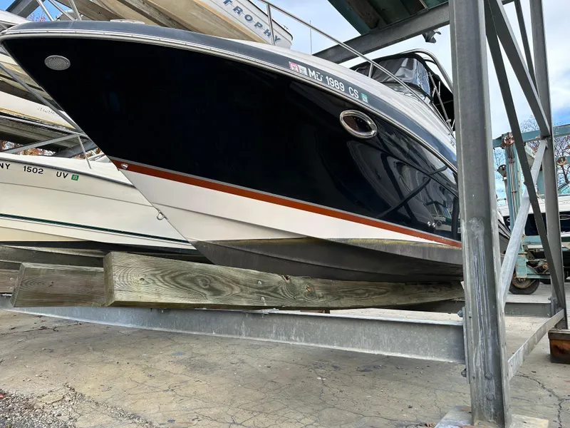 Slide: The Image of 2007 Four Winns 258 Vista boat on a storage rack. - 4