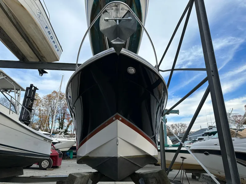 Slide: The Image of 2007 Four Winns 258 Vista boat in dry dock, surrounded by other boats. - 5