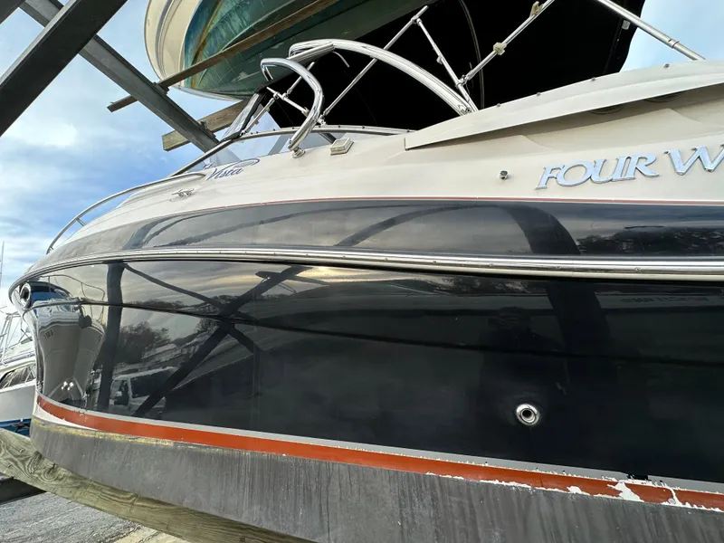 Slide: The Image of 2007 Four Winns 258 Vista boat in dry dock, side view. - 6