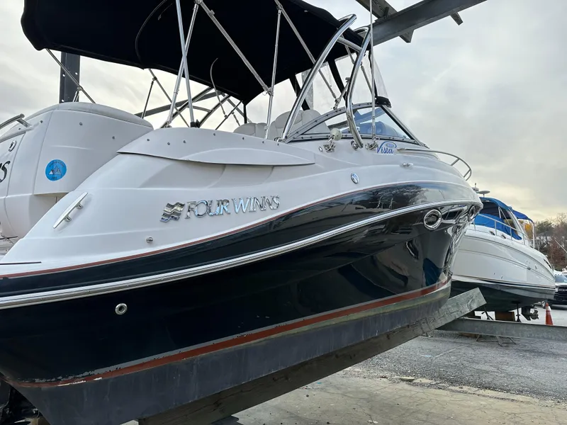 Slide: The Image of 2007 Four Winns 258 Vista boat on dry dock, side view. - 9