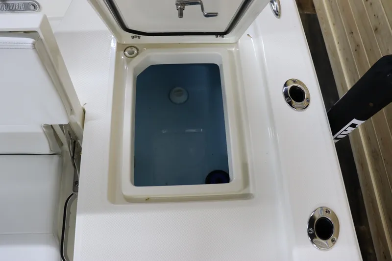 Slide: The Image of 2024 Pathfinder 2200 TRS boat livewell with open lid. - 14