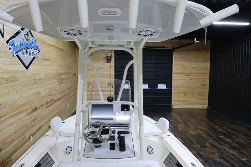 Slide: The Image of 2024 Pathfinder 2200 TRS boat interior with steering console and electronics. - 17
