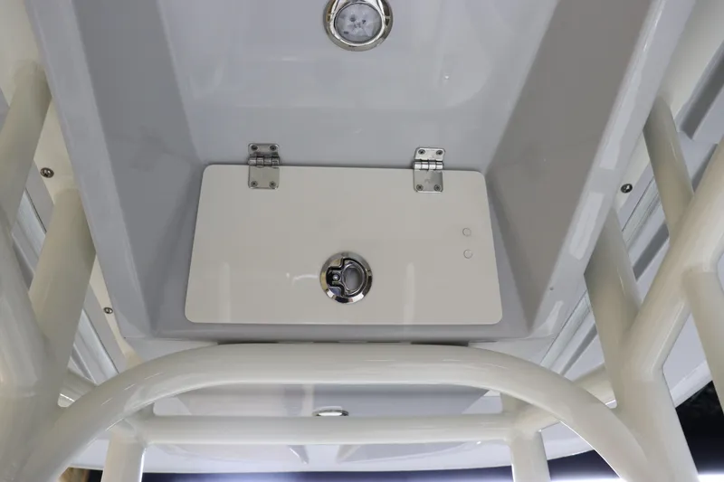 Slide: The Image of 2024 Pathfinder 2200 TRS boat storage compartment with latch and light. - 23