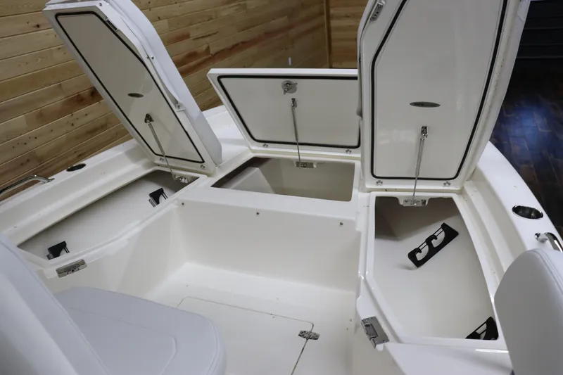 Slide: The Image of 2024 Pathfinder 2200 TRS boat with open storage compartments. - 25