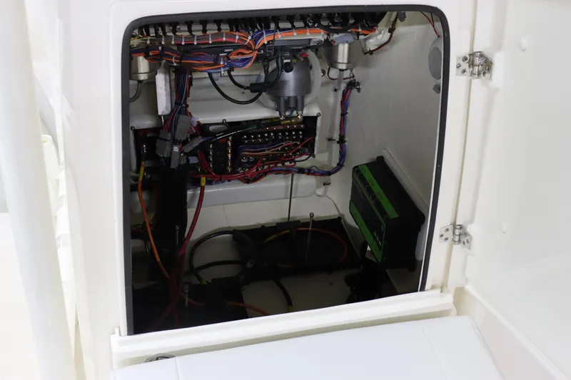 Slide: The Image of 2024 Pathfinder 2200 TRS boat electrical wiring and components inside compartment. - 32