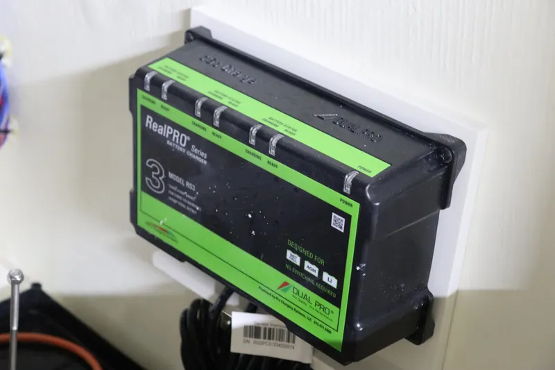 Slide: The Image of 2024 Pathfinder 2200 TRS RealPRO Series battery charger mounted on wall. - 33