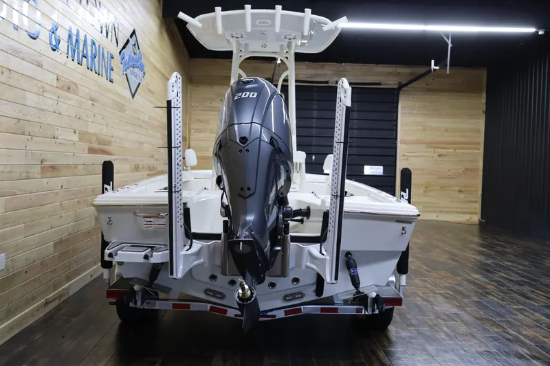 Slide: The Image of 2024 Pathfinder 2200 TRS boat with 200 HP engine in showroom. - 4